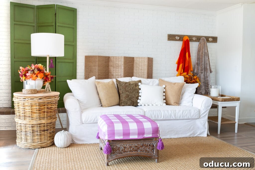 Embracing Autumn Hues in Your Living Space 16 A beautifully fall decorated living room in bright colors, showcasing a vibrant and inviting space, adapted for a unique layout.