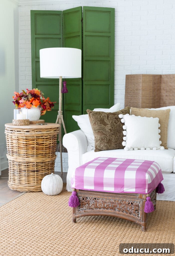 Embracing Autumn Hues in Your Living Space 3 Living room decorated for fall with a fresh color scheme of green, purple, and white, showcasing a minimalist approach to autumn decor.