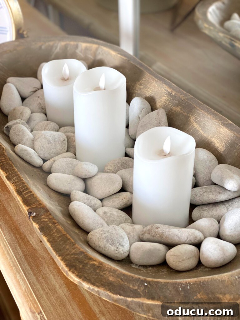 Embracing Autumn Hues in Your Living Space 8 Three battery-operated candles in a rustic dough bowl, adding warmth and texture to a console table, perfect for fall decorating.