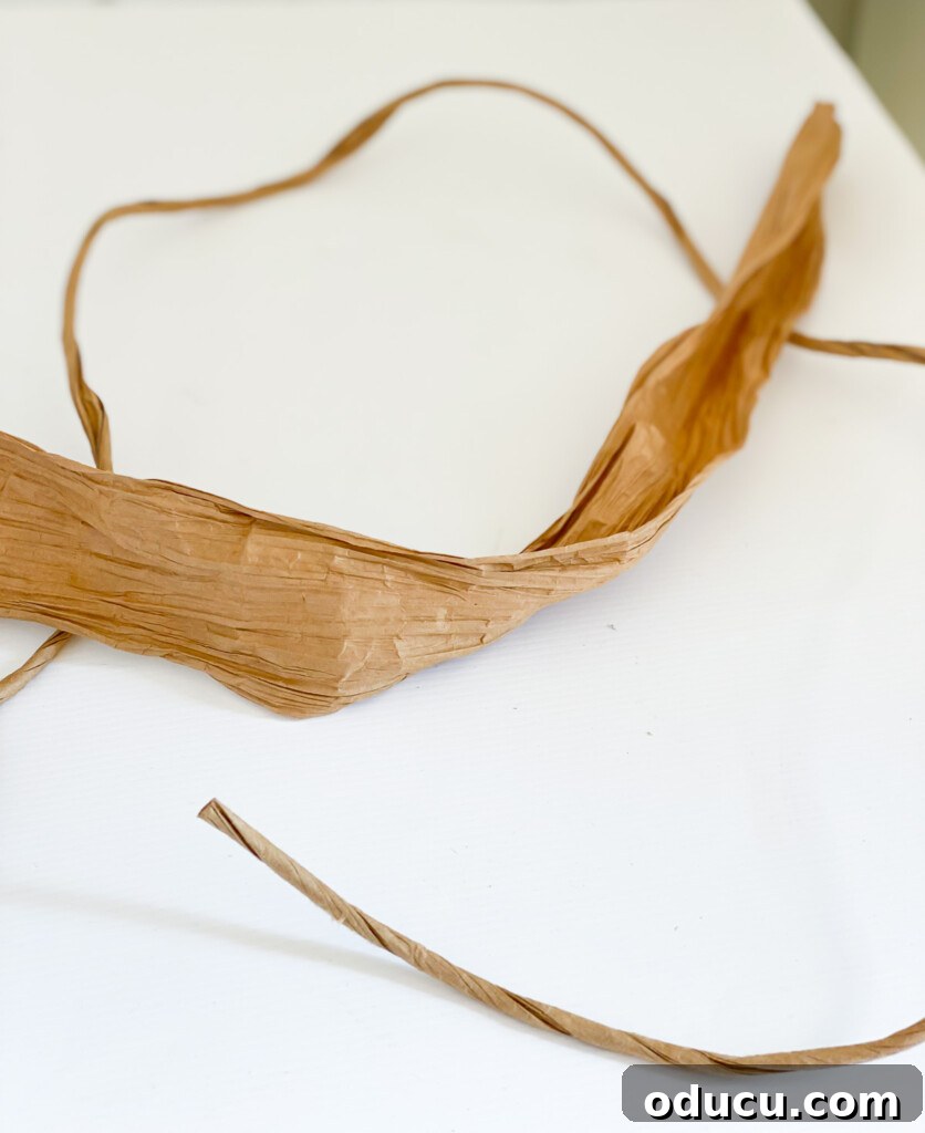 DIY Twisted Paper Ribbon Vase and a Creative Bonus Project 13 untwisted paper cord on table
