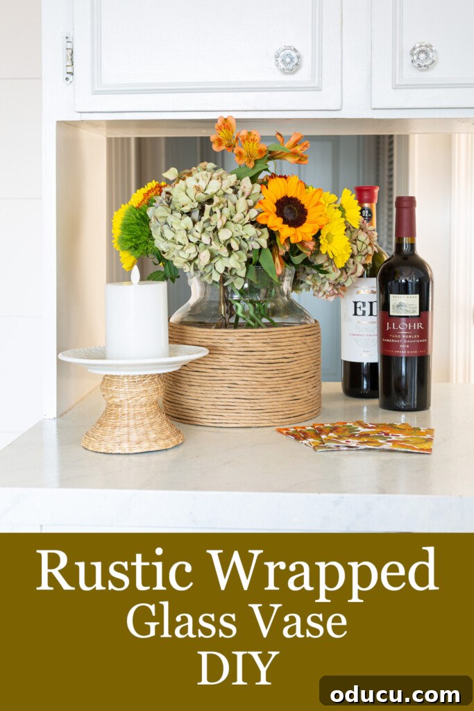 DIY Twisted Paper Ribbon Vase and a Creative Bonus Project 15 Twisted paper ribbon wrapped glass vase filled with fall flowers on kitchen counter