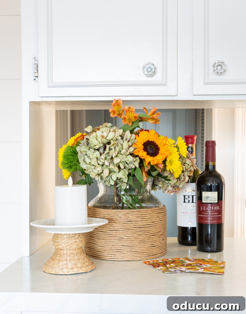 DIY Twisted Paper Ribbon Vase and a Creative Bonus Project 3 craft paper twist cord on a vase on a kitchen counter.