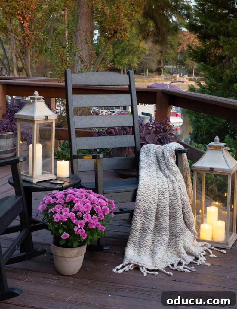 Cozy Fall Home Challenge 8 Beautifully arranged cozy fall outdoor decor on a lakeside deck, featuring comfortable seating and ambient lighting for a relaxing atmosphere.