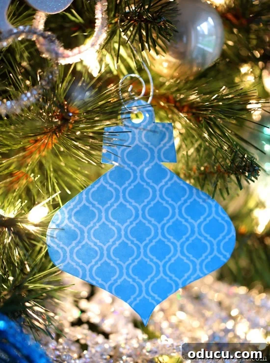 Craft 15 Beautiful Christmas Ornaments You'll Cherish 7 Collection of paper Christmas tree ornaments in vintage shapes.