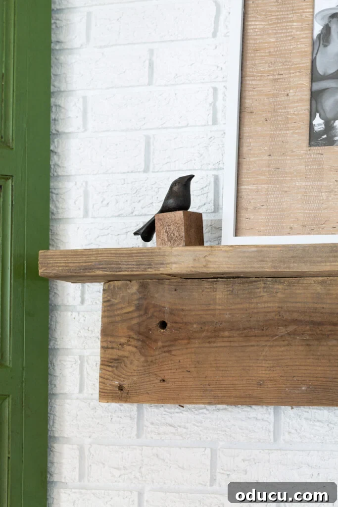 Effortless DIY Fireplace Mantel 5 small bird figurine on rustic DIY fireplace mantel