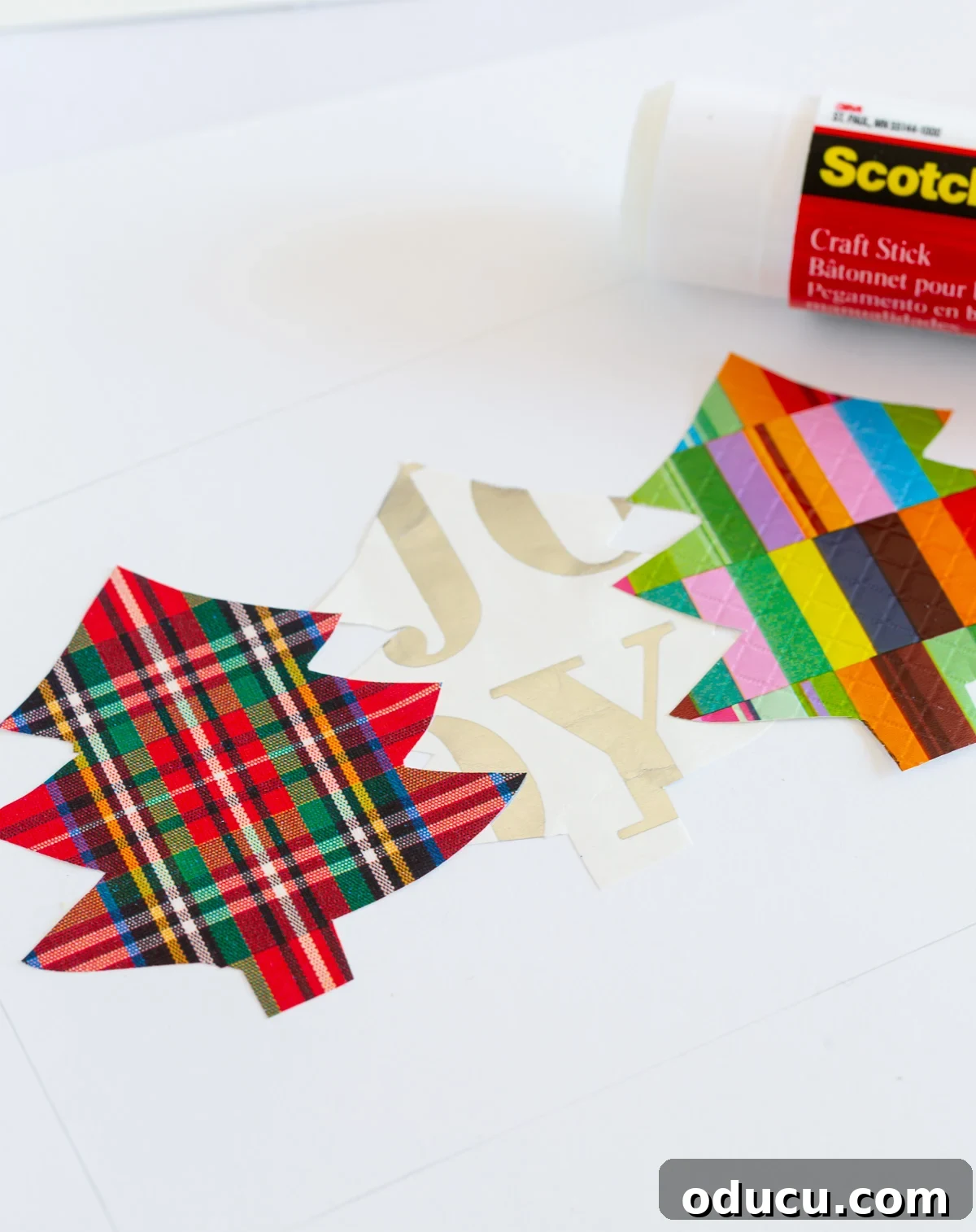 glue gift wrap cut out trees onto card