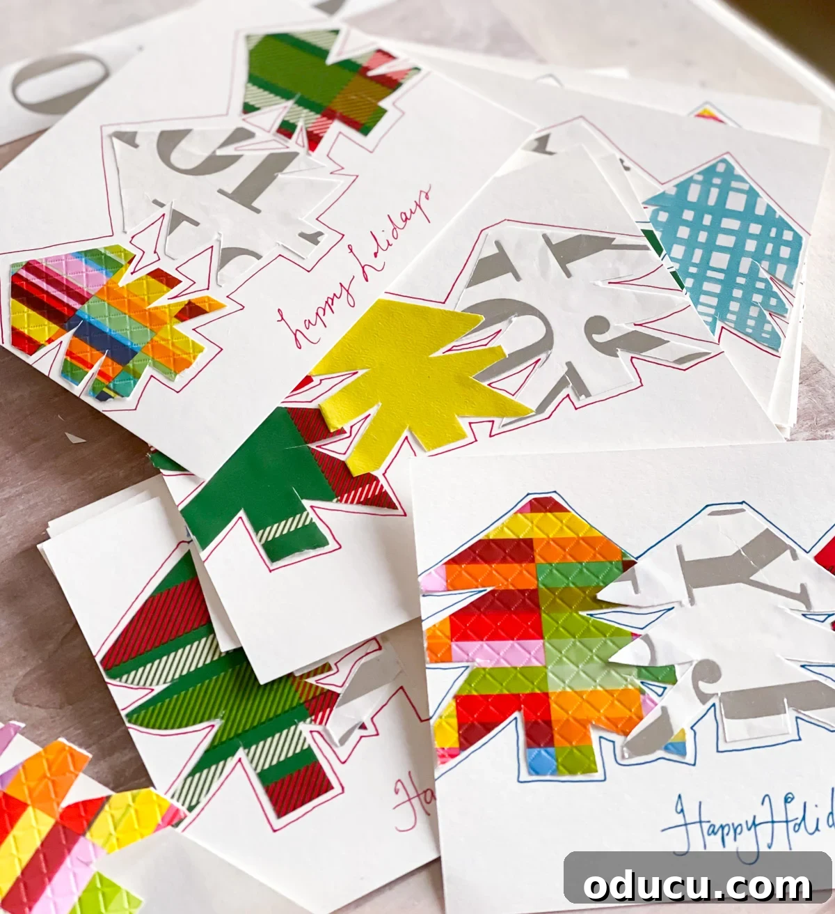 A collection of DIY Christmas cards on a table.