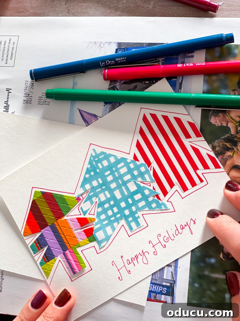 Finished Christmas card that has 3 trees cut out from gift wrap