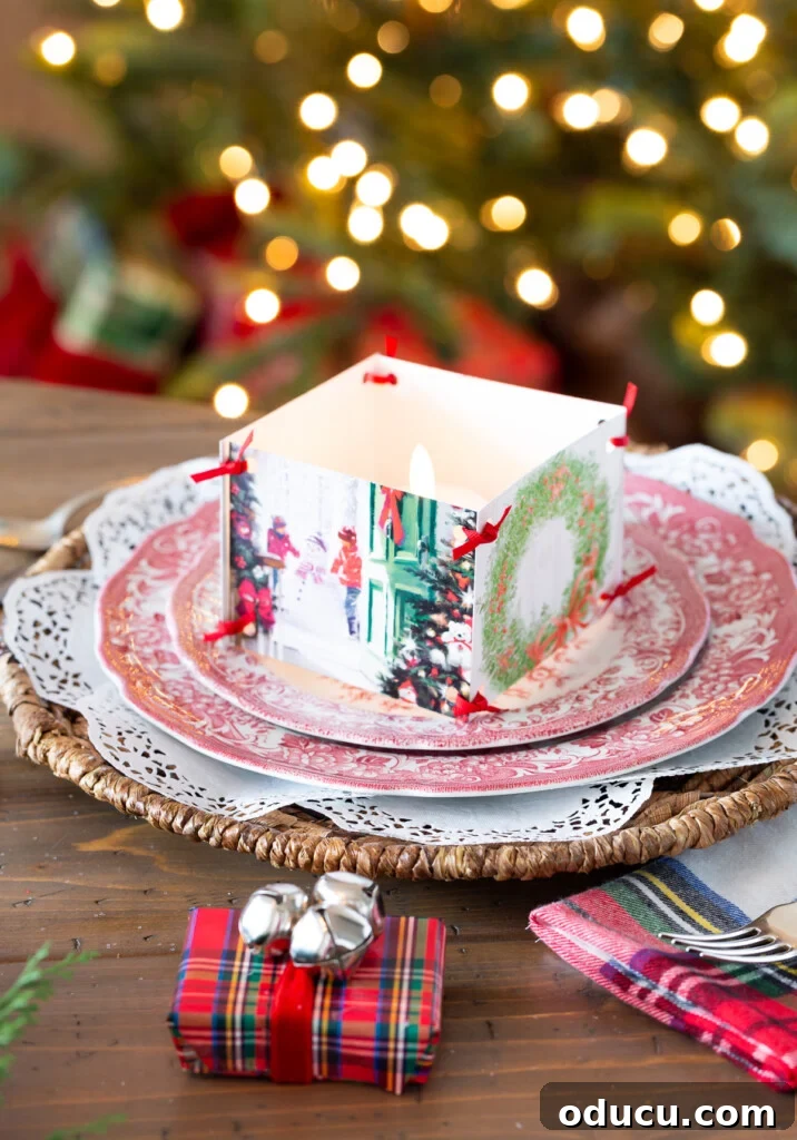 Christmas tablesetting idea using old Christmas cards to accent a small candle on a dinner plate.