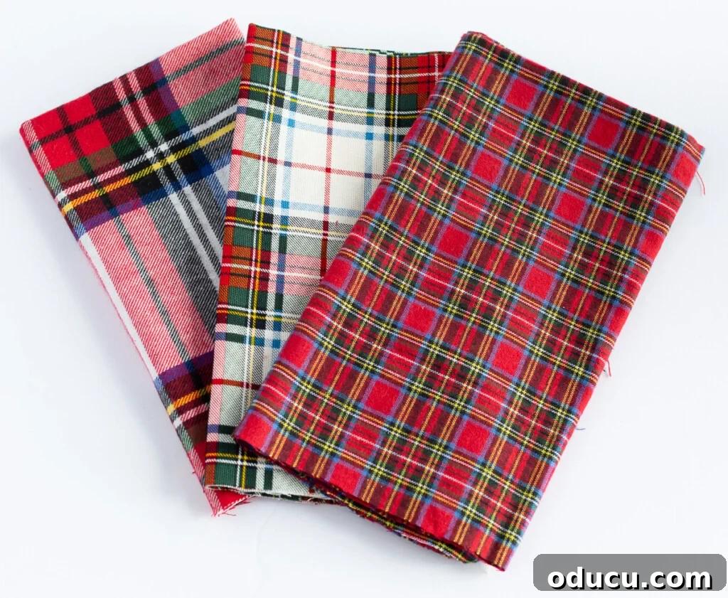 3 red plaid fabrics made into dinner table napkins.