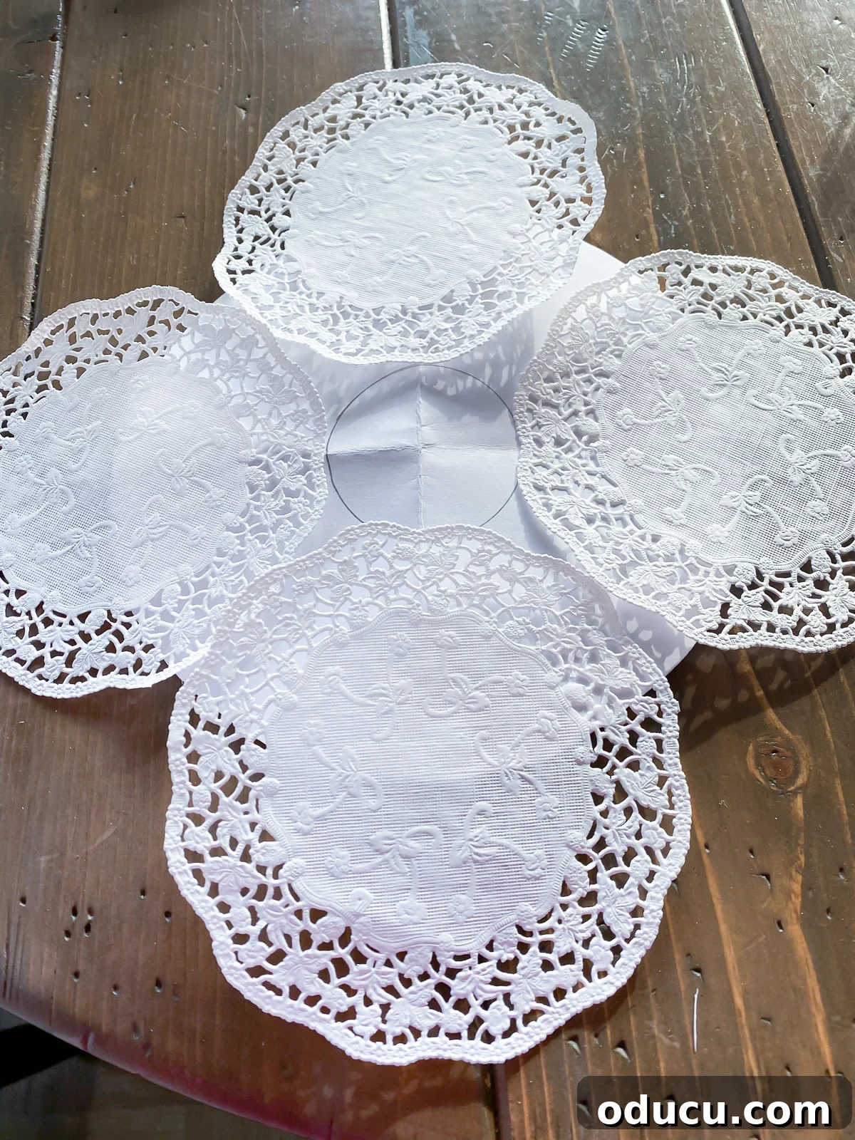 How to make a round dinner table placemat using paper doilies.