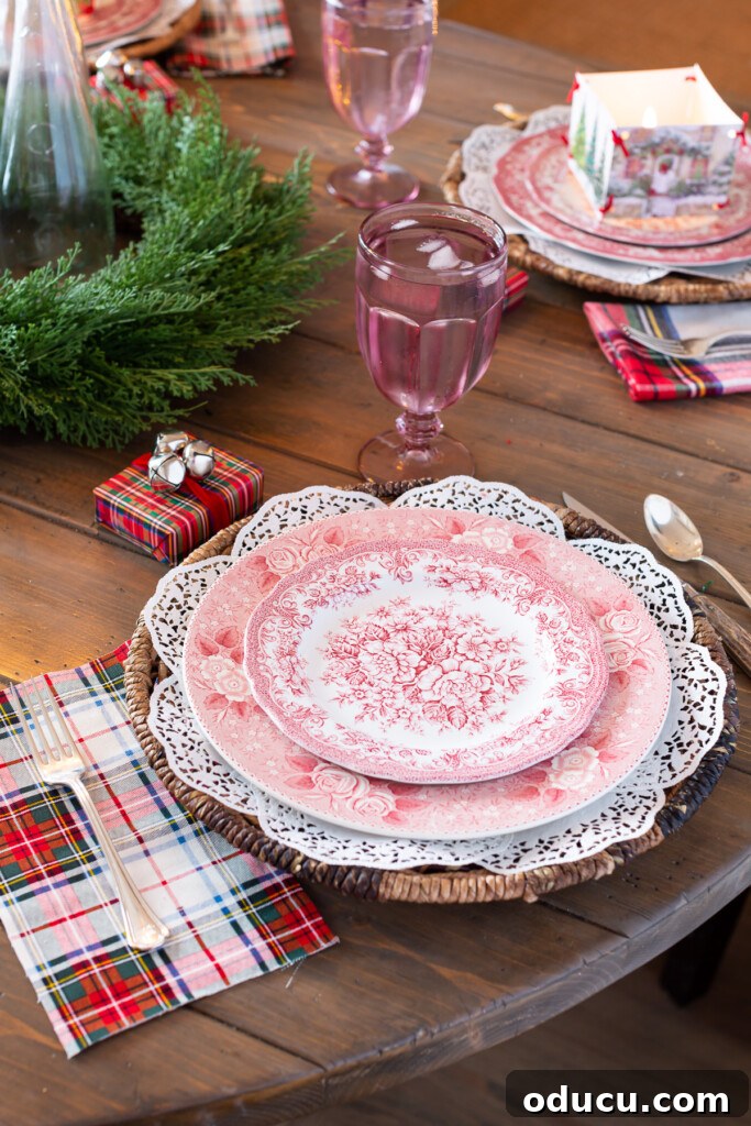 DIY Charming Paper Doily Placemats and Plate Chargers 10 red and white plates on white paper doily charger with red plaid accents.
