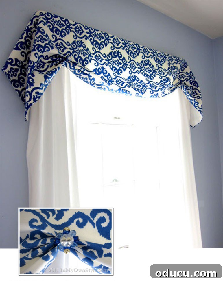 Repurpose Your Jewelry for Home Decor 12 A blue and white window valance creatively enhanced with old jewelry used as decorative accents, adding unique flair.