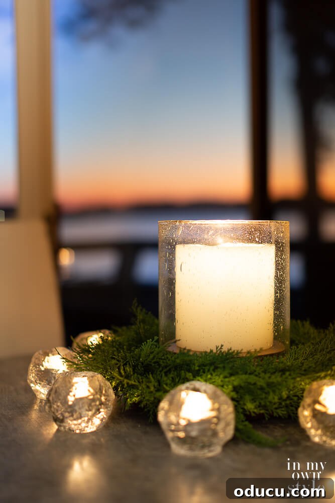 My Favorite Gift Ideas 7 Large candle in seeded glass hurricane on kitchen table with smaller candles around it to provide cozy light.