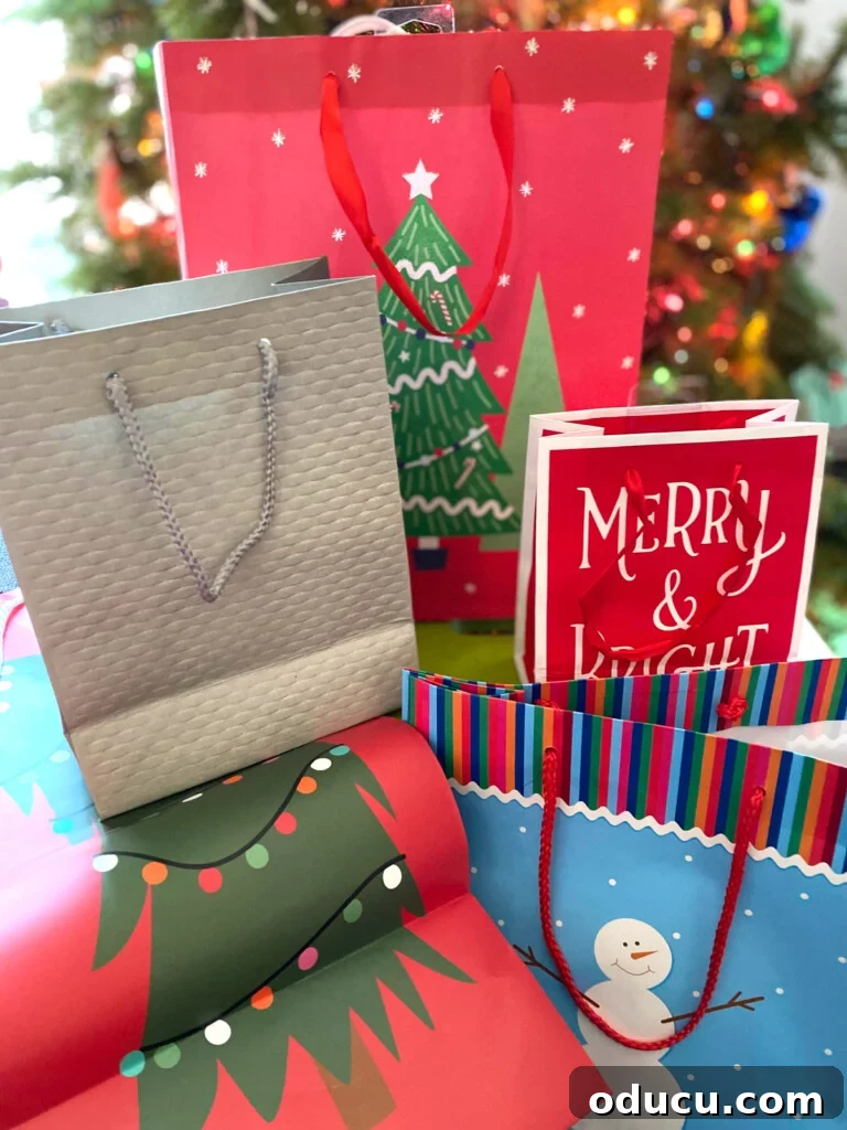 Smart & Stylish Ways to Repurpose Gift Bags for New Gifts 2 Christmas gift bags displayed on a table, showcasing creative reuse ideas.