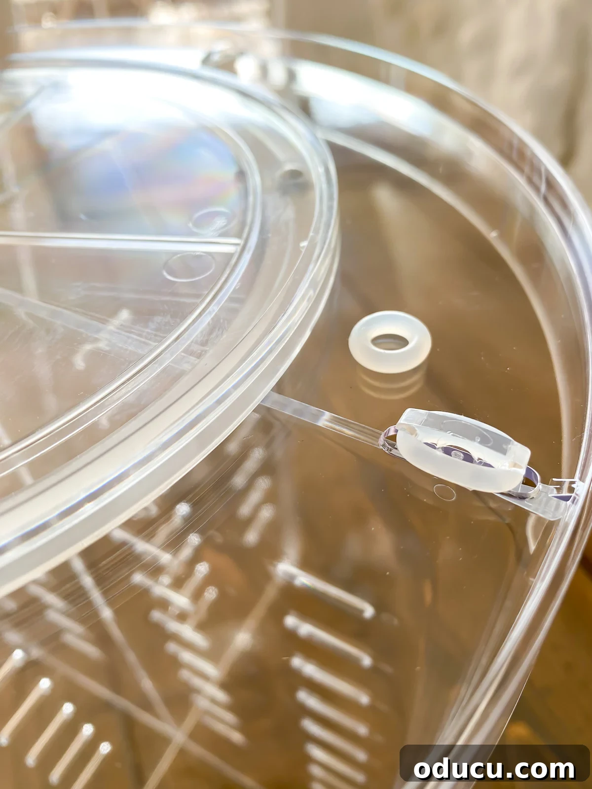 Close-up of a rubber ring being used to secure the base of the 3-tier bathroom counter organizer.