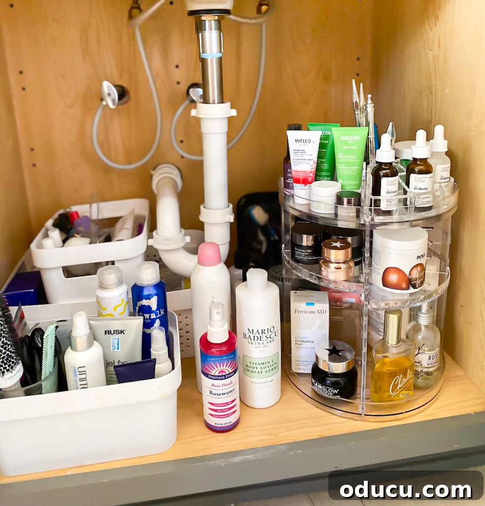 Triple-Tier Revolving Bathroom Organizer 6 Under a bathroom sink, a 3-tier rotating bathroom organizer showcasing its storage capacity.
