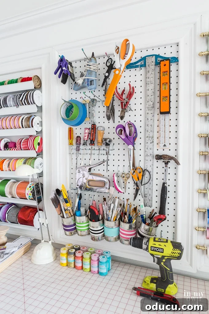 31 Clever & Chic Craft Room Ideas 12 Craft room in house featuring a framed pegboard for tool organization
