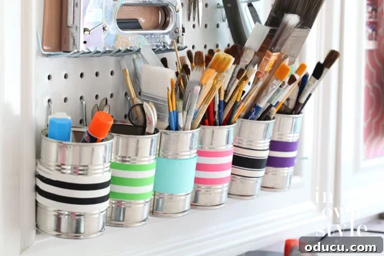 31 Clever & Chic Craft Room Ideas 13 Tool organizing ideas for craft rooms using colorful tin cans on a pegboard