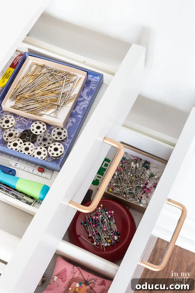 31 Clever & Chic Craft Room Ideas 24 Organized drawers in a craft room sewing corner using small boxes as dividers
