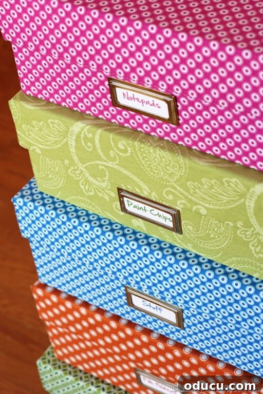 31 Clever & Chic Craft Room Ideas 29 Colorful stacked storage boxes in a craft room, covered with fabric