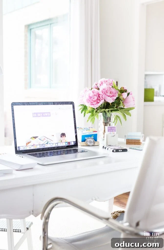 31 Clever & Chic Craft Room Ideas 36 How to create and set up a home office within a craft room, featuring a well-organized desk