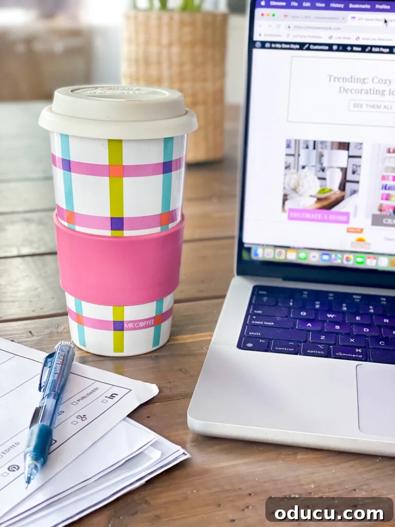 Our Teacup Talk 2 A colorful ceramic travel mug filled with hot tea sits next to a laptop, inviting a virtual chat session.