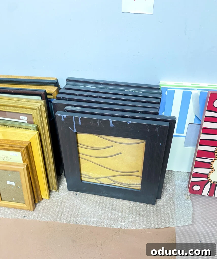 Our Teacup Talk 8 A stack of black picture frames, complete with glass, found at a thrift shop, awaiting a creative transformation.