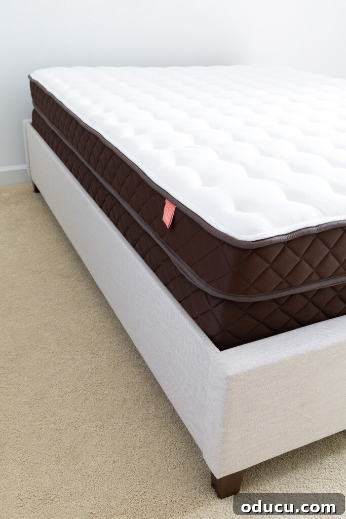 Christeli Charleston Mattress: What You Need to Know 6 Looking at the corner of a Christeli Charleston mattress in Eastman platform bed frame.