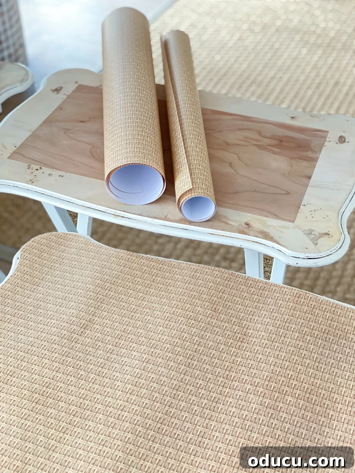 Wood tray table set getting a makeover using wicker print gift wrap and decoupage.