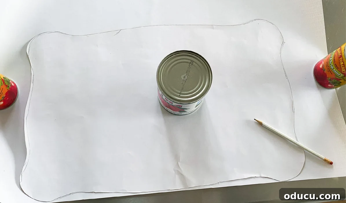how to cut out paper to decoupage it onto furniture. Use food cans to hold paper down.