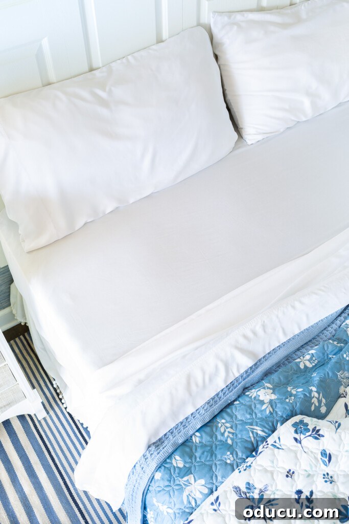 Bedroom Blooms: Your Instant Spring Refresh 5 Close-up of Bedsure Bamboo Sheets in pristine white on a master bedroom bed, highlighting their soft texture.