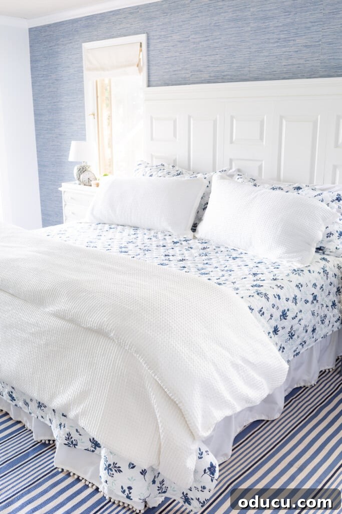 Bedroom Blooms: Your Instant Spring Refresh 6 Cozy lightweight summer floral bedding layered beautifully on a bed in a blue and white decorative scheme.