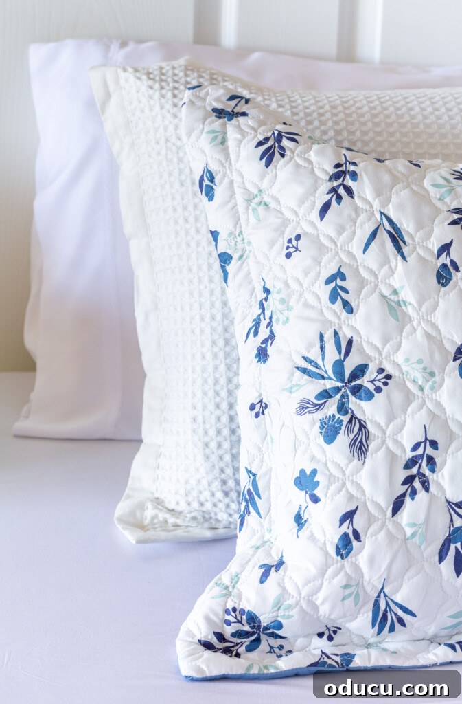 Bedroom Blooms: Your Instant Spring Refresh 8 Bedsure pillows and shams neatly arranged on a bed with crisp white sheets, showcasing texture and pattern.