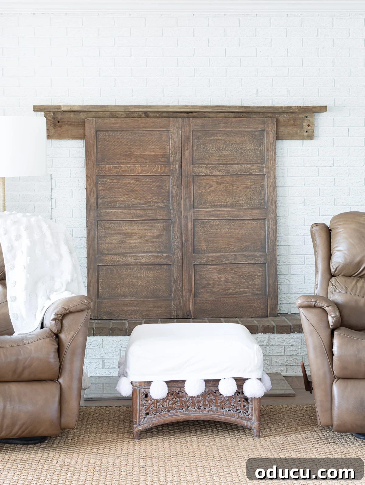 Found Treasure: My Living Room's Fireplace Cover 12 Two wood panels thoughtfully repurposed from the sides of an old wood file cabinet, now cleverly transformed into an elegant folding fireplace cover.