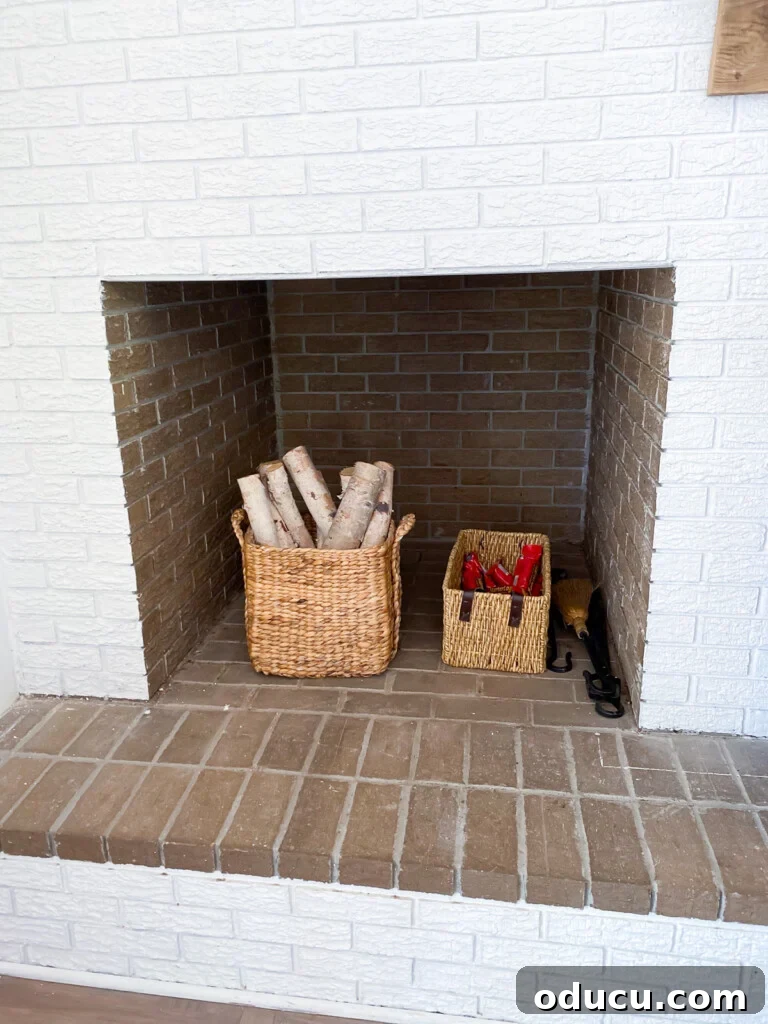 Instant Brick Wall: DIY with Faux Panels from Your Local Store 2 Cleaned out fireplace wood storage built into a brick wall in a living room ready for a summer cover