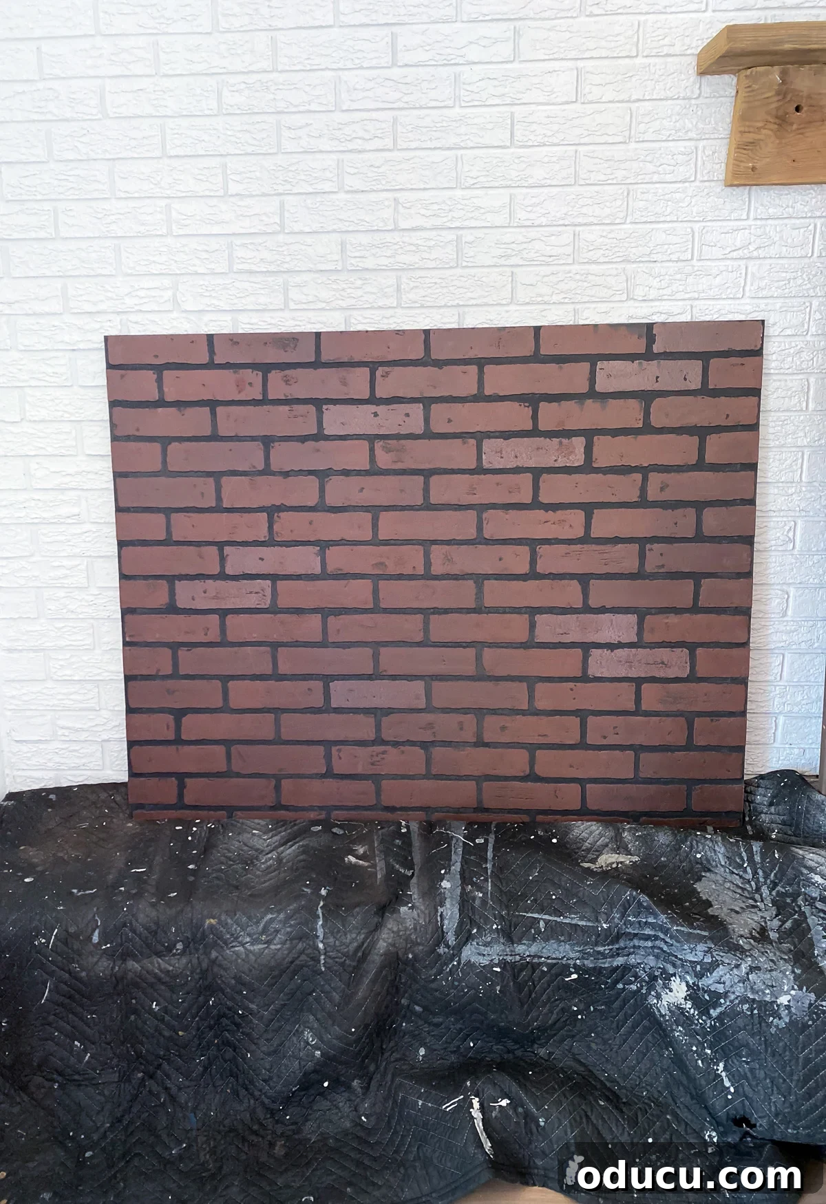 Instant Brick Wall: DIY with Faux Panels from Your Local Store 9 A faux brick panel from Lowes precisely cut to the size needed to cover an opening in a brick wall.