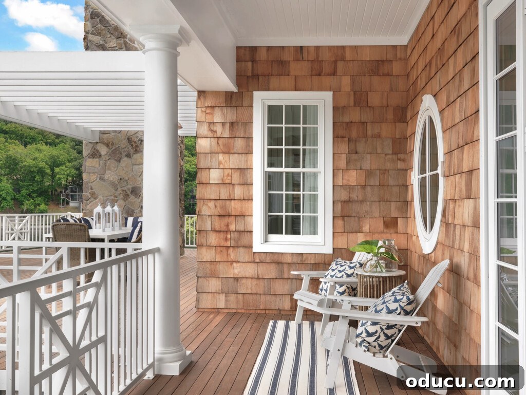 The Style Edit 141 2 A charming Nantucket house featuring a welcoming porch with classic architectural details and lush greenery, embodying serene coastal living.