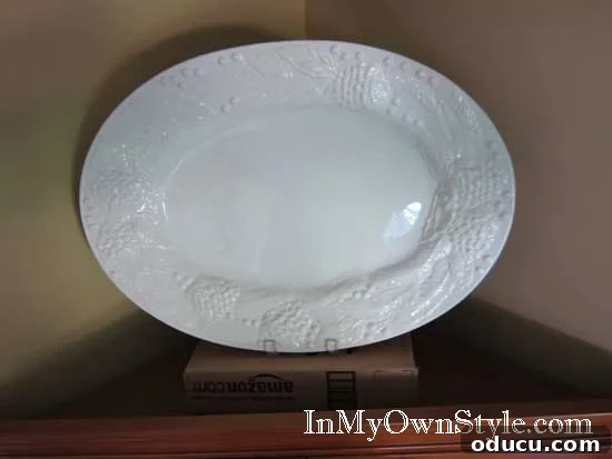 How to display plates on top of hutches and wall cabinets. Using hidden boxes to elevate decorative plates on a hutch