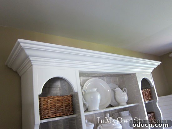 How to add lighting to the top of a dining room hutch or china cabinet. Daylight view of a dining room hutch without ambient lighting