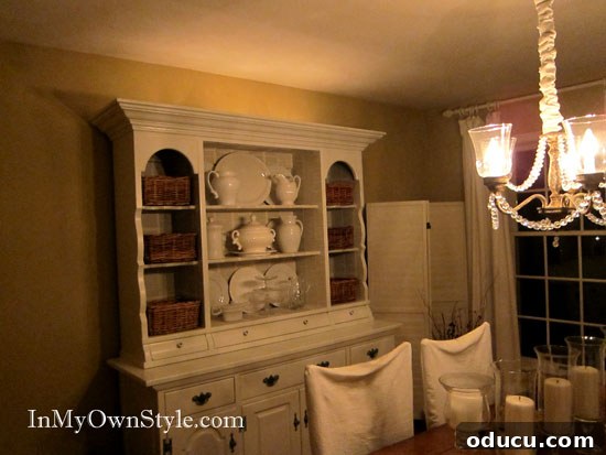 Dining room lighting tips that will add ambiance to your dinner parties Dining room lit with a combination of chandelier and accent lighting