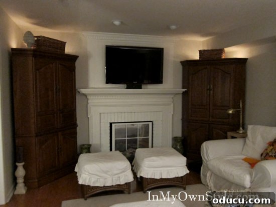 How to add lights to the top of hutches and wall cabinets Family room with corner cabinets illuminated by decorative lights