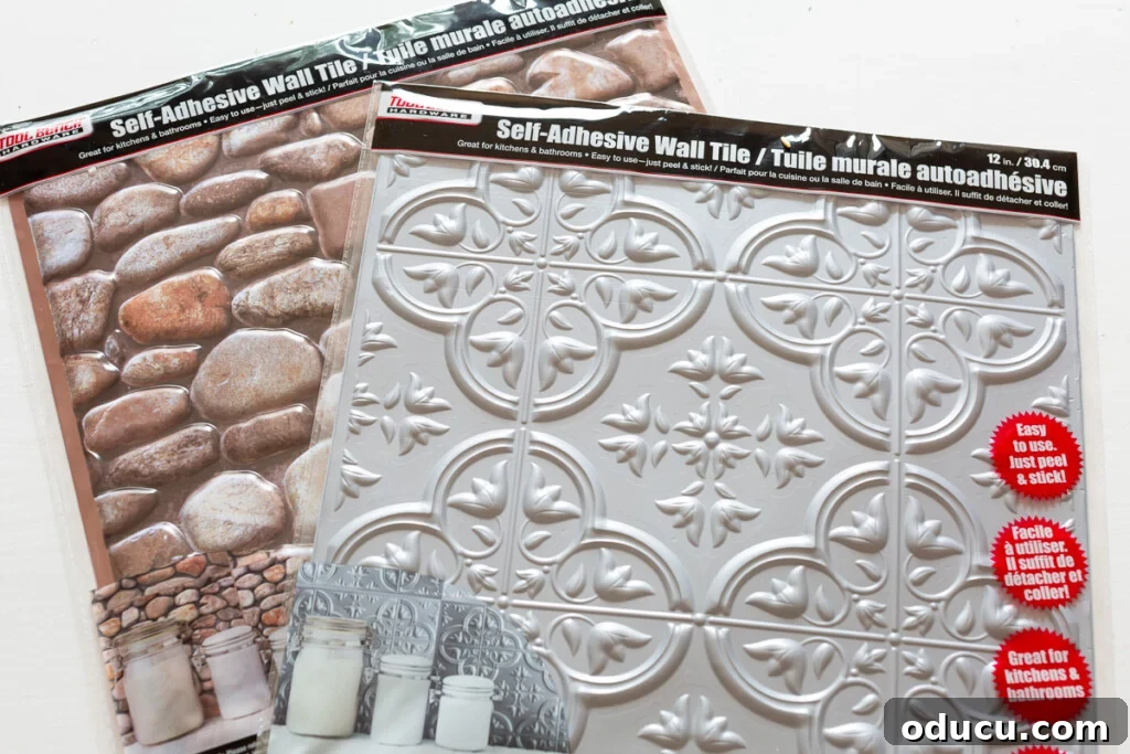 Self-adhesive wall tiles from the dollar store, featuring faux stone and vintage tin designs, ready to be used for upcycling picture frames.