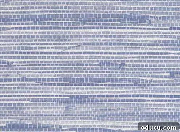 Swatch of Light-Blue-Faux-Grasscloth-Wallpaper, a stylish leftover piece ready for crafting elegant photo frame mats.