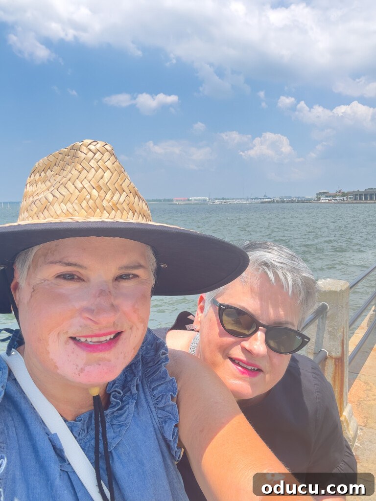 Diane and Carol in walking along the walkway along E Battery and the harbor.
