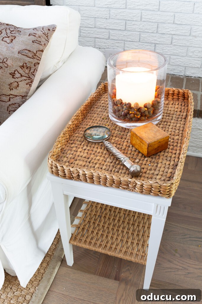 Creating a Cozy Fall Living Room Sanctuary 17 Woven tray side table in living room decorated for fall.