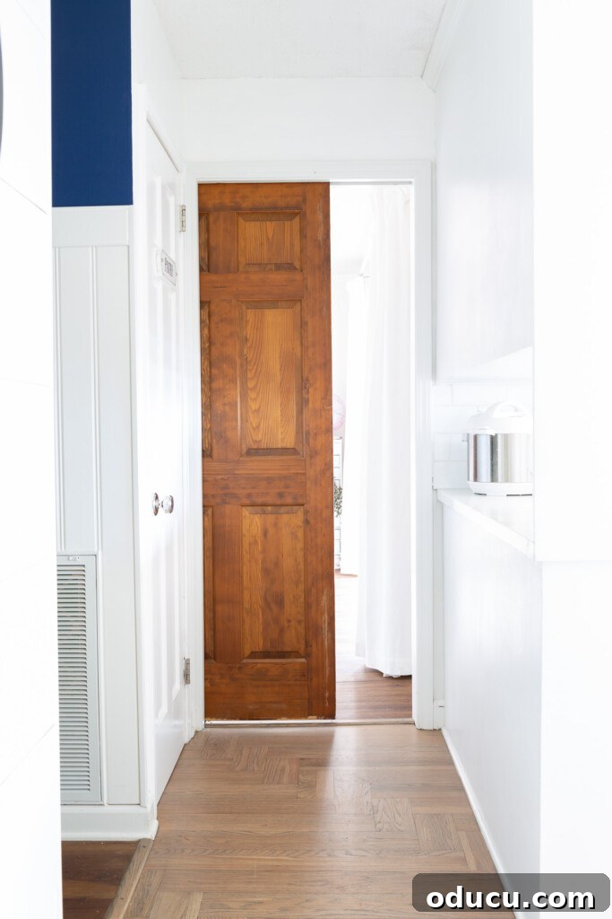 Modern Kitchen Renovation Butler Pantry and Hidden Murphy Door 7 Wood pocket door at entrance to room where one side is being transformed to become a Butler's pantry and kitchen storage area.