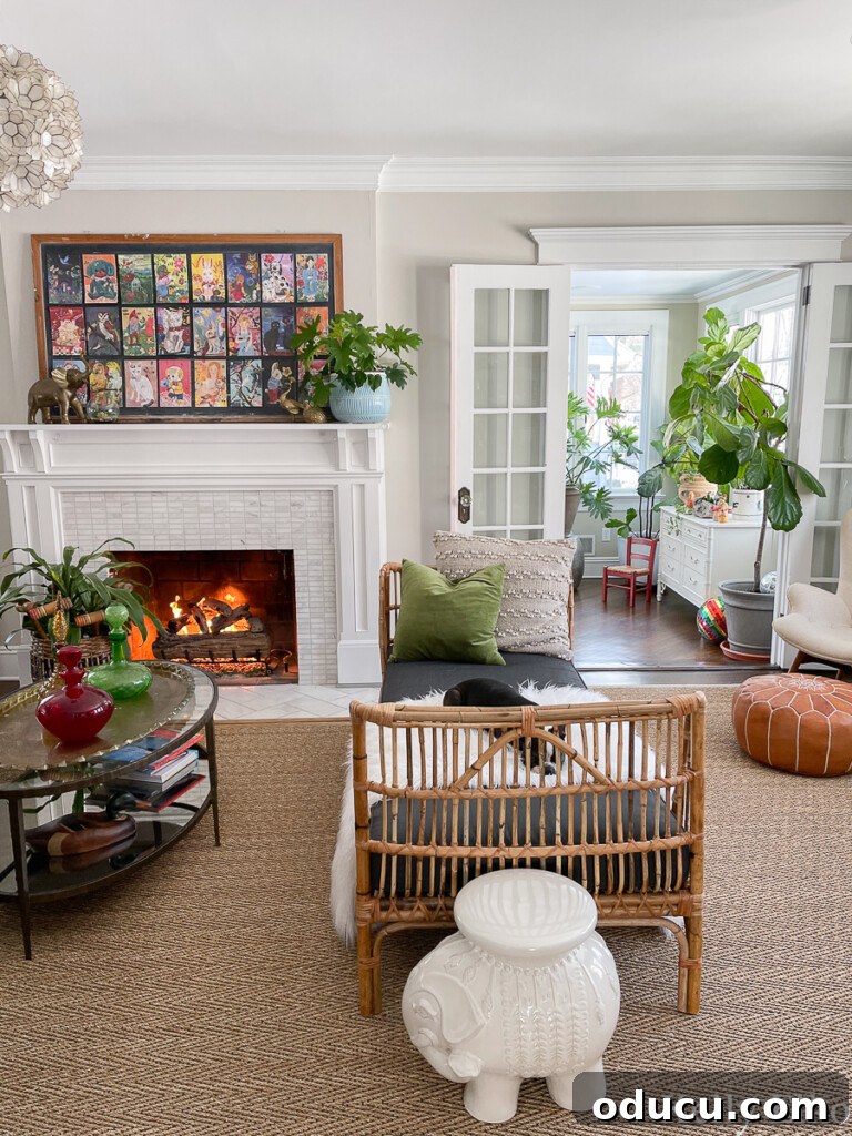 Discover Your Signature Decor Style 9 Kelly Elko's living room with eclectic-decor-rattan-colorful-art-plants.