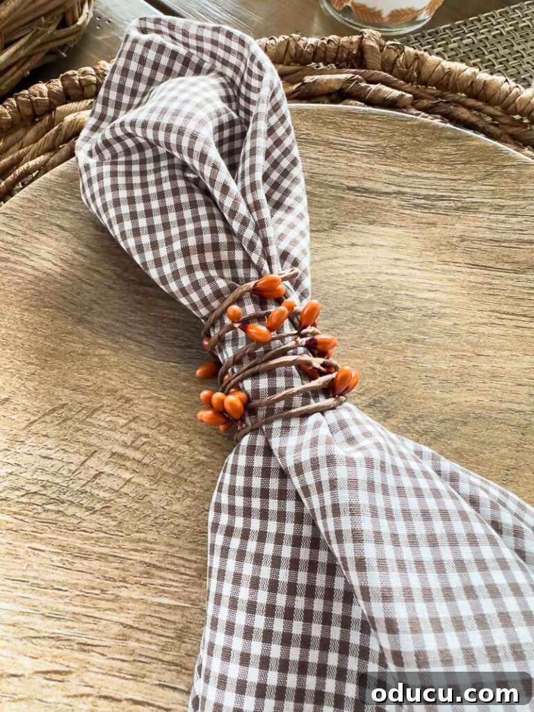 Simple & Stunning Thanksgiving Table Settings 11 Fall colored berry wire from Hobby Lobby used to make napkin rings for a Thanksgiving table place setting