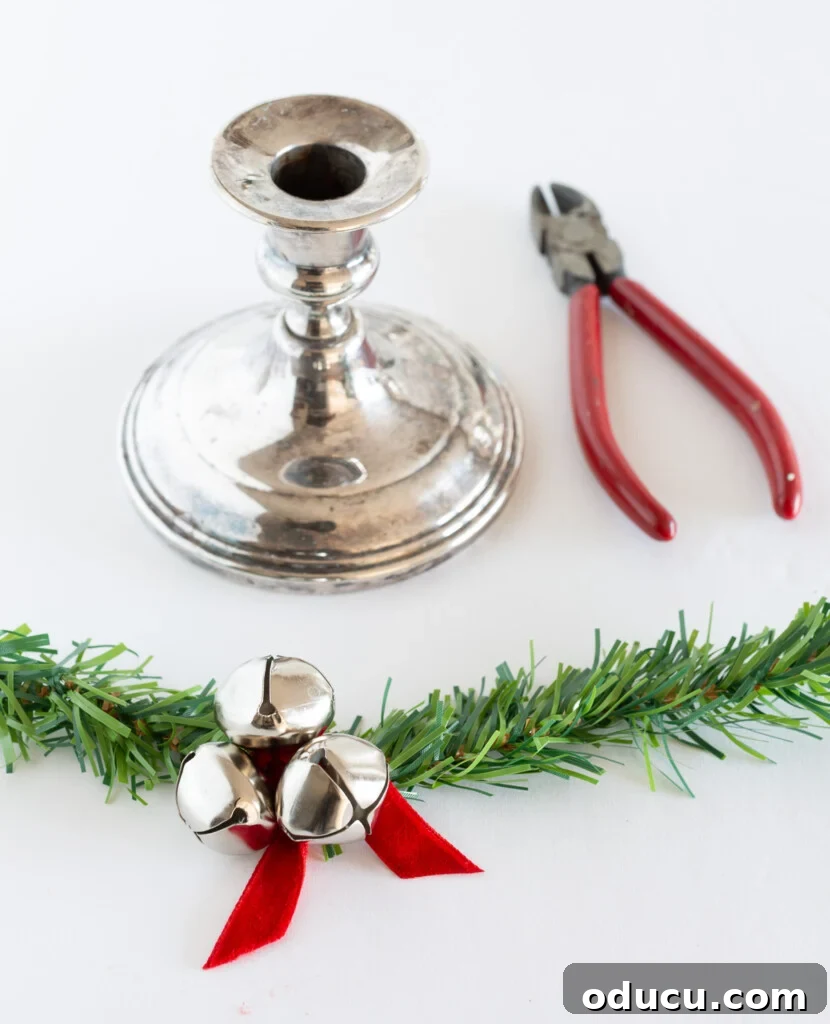 Simple Steps to Gorgeous Christmas Taper Candle Rings 11 DIY instructions for creating a festive taper candle ring using a faux evergreen garland tie and cheerful jingle bells for Christmas home decor.